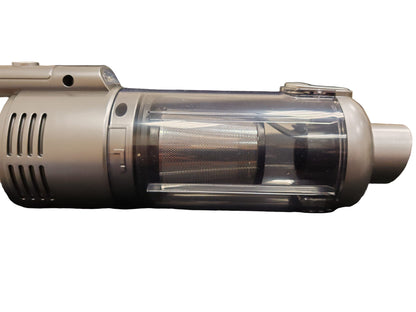Close-up of a cylindrical vacuum cleaner on a dark surface
